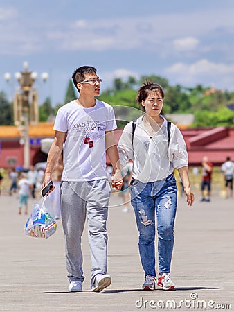 Couple on a sunny Tiananmen Square, Beijing, China Editorial Stock Photo